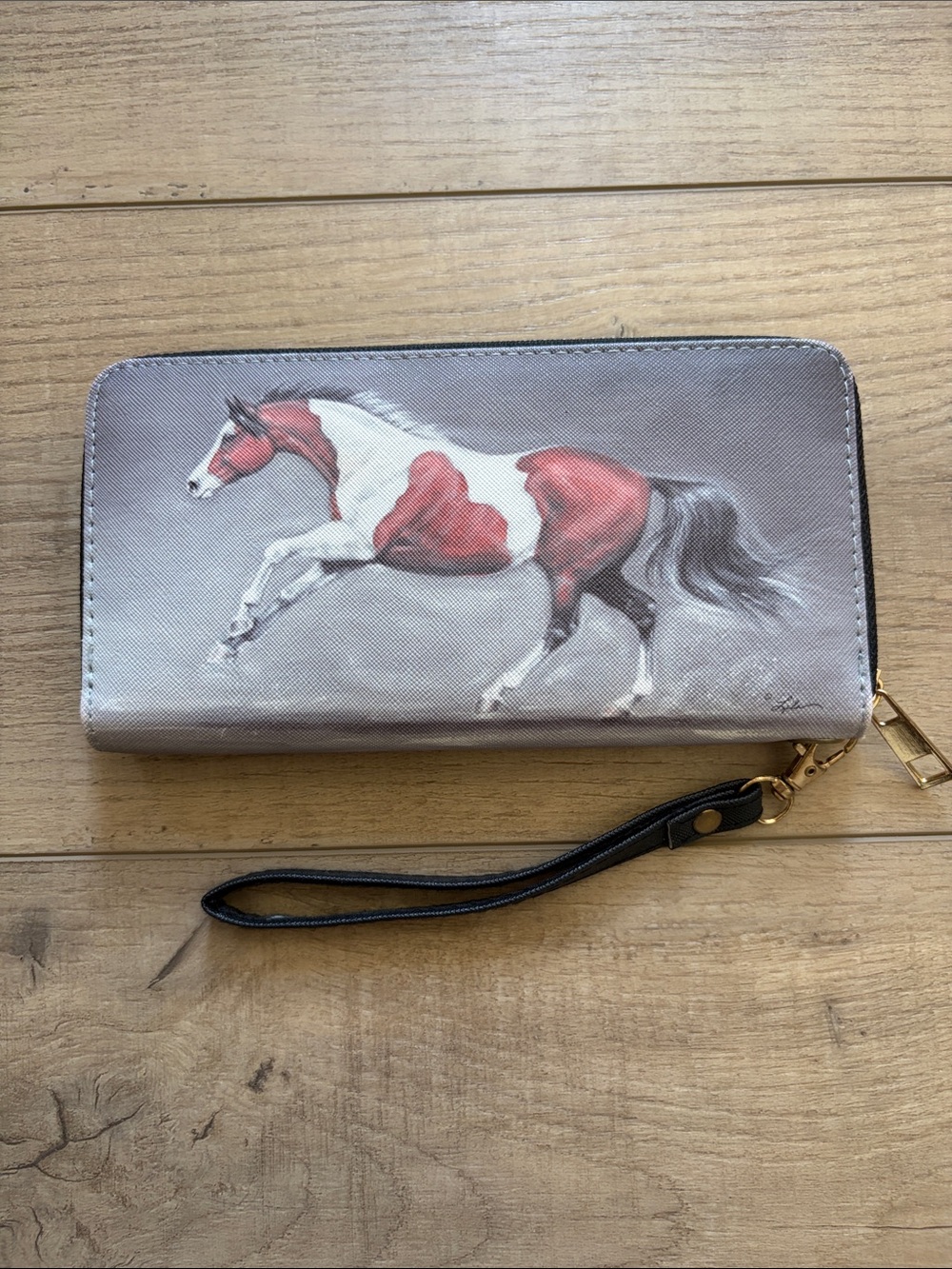 Wallet in excellent condition with wrist strap